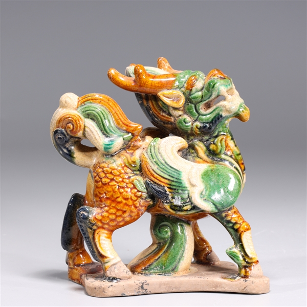 Appraisal: Chinese Tang style sancai glazed qilin figure overall good condition