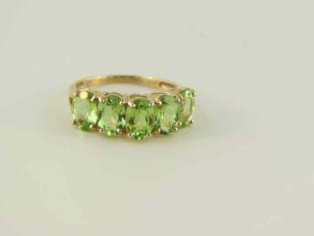 Appraisal: Peridot Ring vivid oval gems in k yellow gold