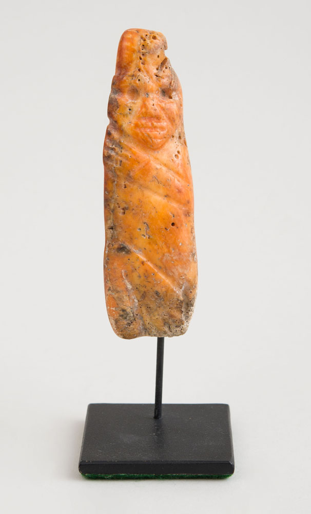 Appraisal: OCEANIC CARVED STONE FIGURE Now raised on a stand x