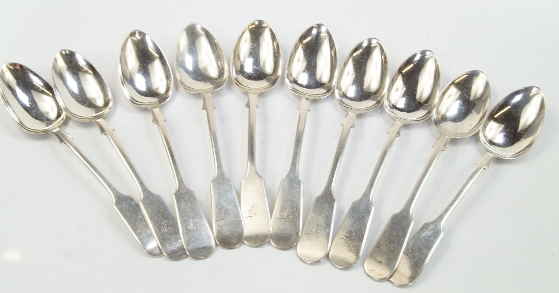 Appraisal: A set of nine Aberdeen silver teaspoons decorated in the