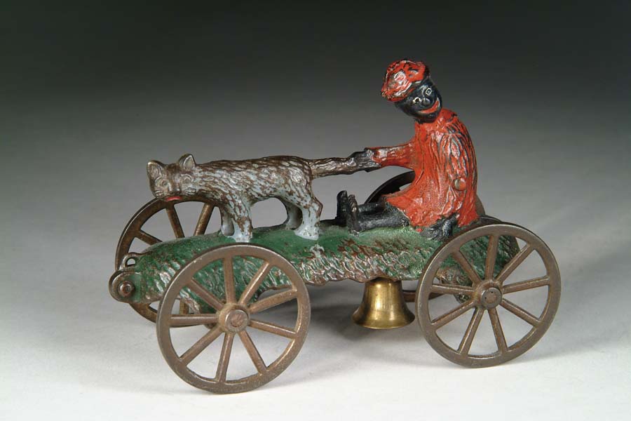 Appraisal: CAT AND NEGRO BOY BELL TOY Manufactured by N N