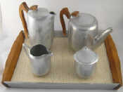 Appraisal: A four piece Picquot Ware teaset comprising teapot water jug