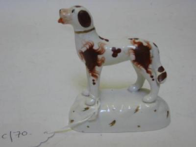 Appraisal: A STAFFORDSHIRE POTTERY DOG th century modelled standing with rust