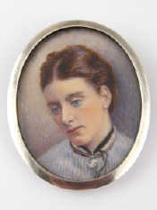 Appraisal: An oval silver framed brooch miniature of a lady x