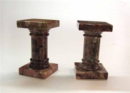 Appraisal: Pair of rose marble bookends in the form of columns