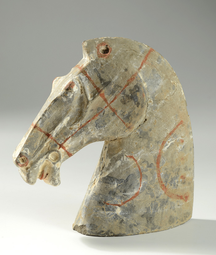 Appraisal: CHINESE HORSE HEAD Han dynasty style With traces of red