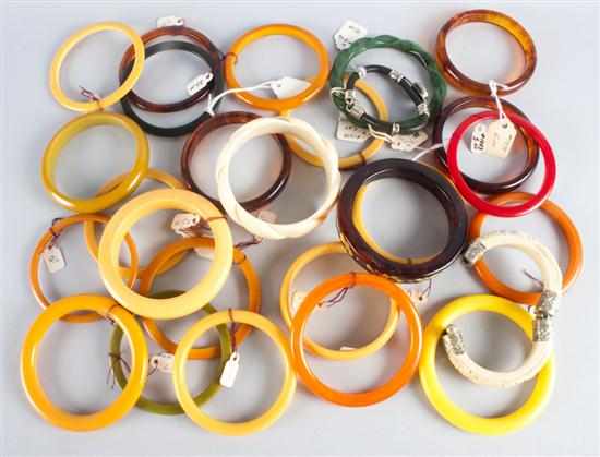 Appraisal: Large group of Bakelite plastic and carved bone bangle bracelets