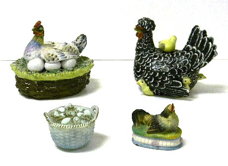 Appraisal: Chicken Egg basket figures four pieces crested hen with chicks