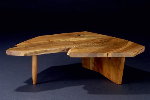 Appraisal: GEORGE NAKASHIMA Walnut Conoid coffee table with burl free-edge top