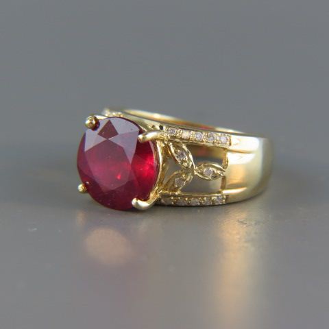 Appraisal: Ruby Diamond Ring round rich gem weighing carats surrounded by