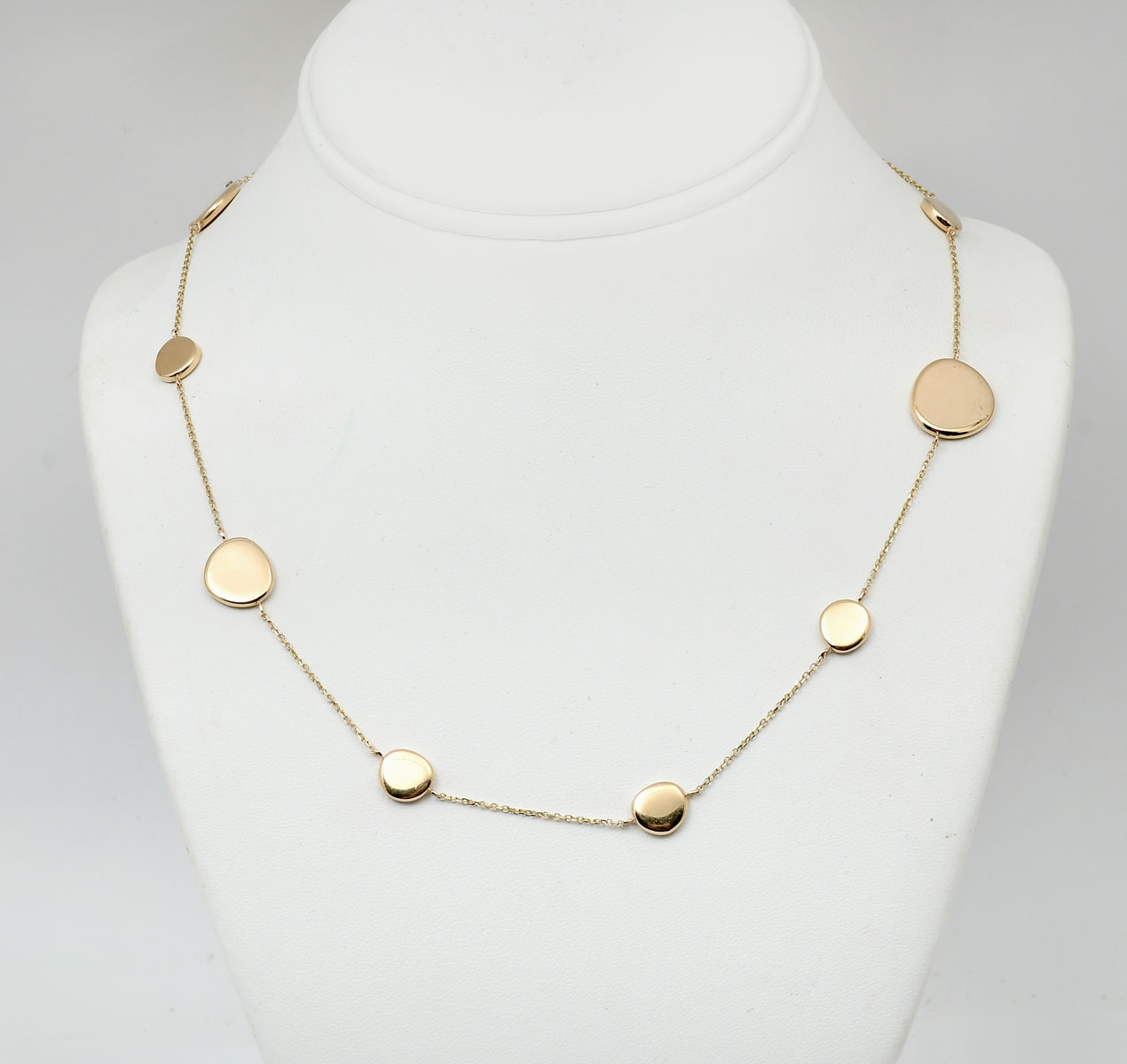 Appraisal: K ITALIAN STATION NECKLACE Shiny K yellow gold discs alternate