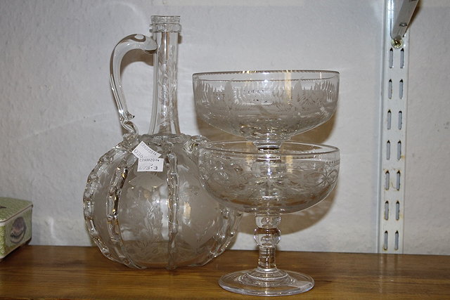 Appraisal: A DUTCH STYLE ETCHED GLASS DECANTER and two Victorian pedestal