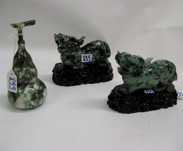 Appraisal: THREE HAND CARVED JADE FIGURES pair of single horned creatures