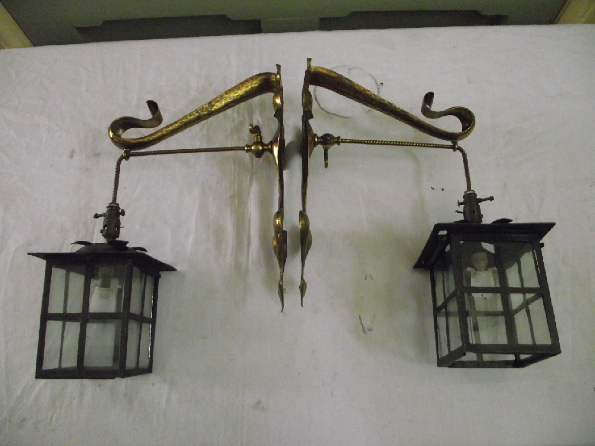 Appraisal: A pair of Art Nouveau brass single branch wall gas