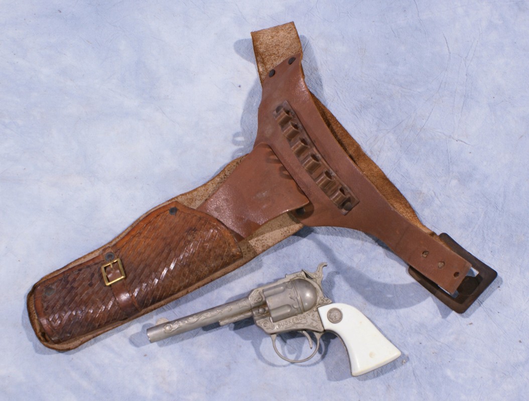 Appraisal: Leather holster with cap gun marked Buckaroo gun long