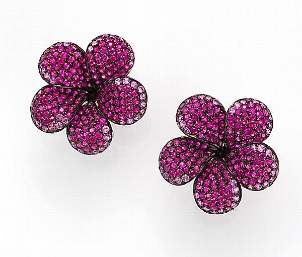 Appraisal: A pair of ruby pink sapphire and eighteen karat blackened