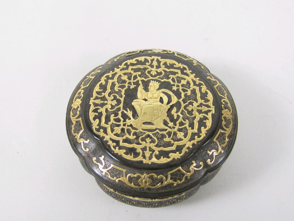 Appraisal: A shaped circular Tortoiseshell Box with gold inlaid decoration scrolled