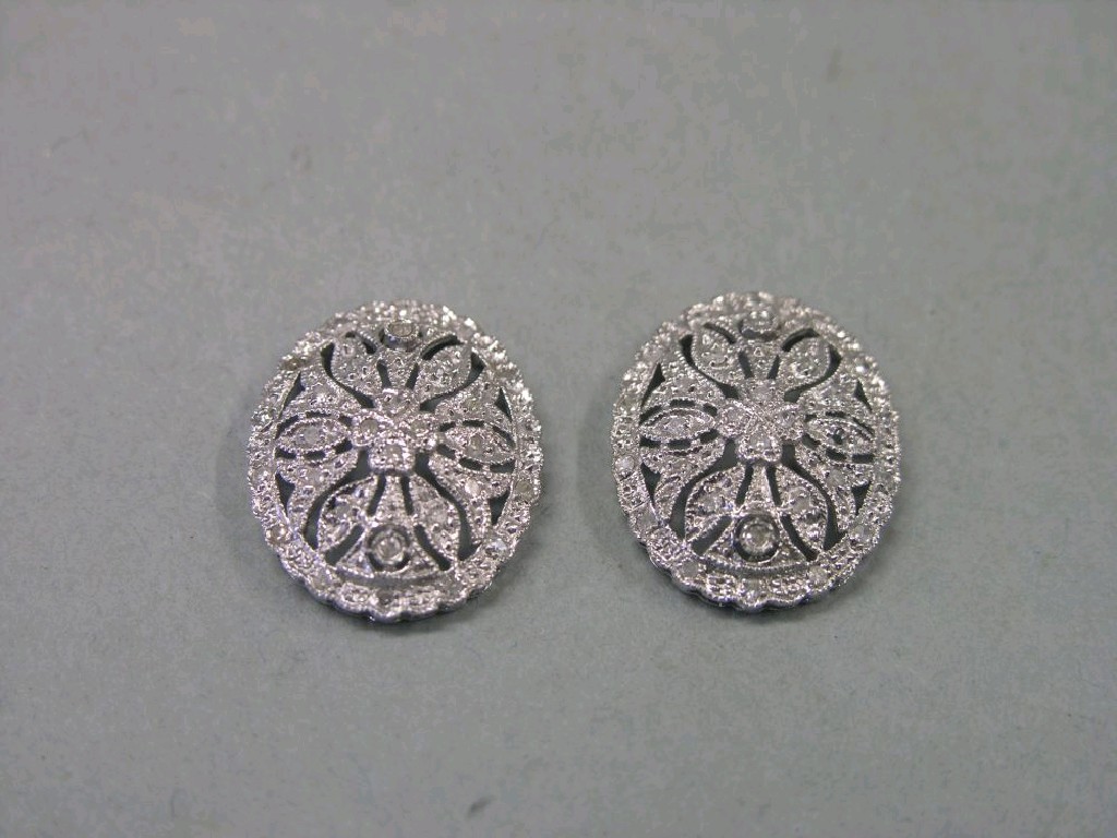 Appraisal: A pair of white metal and diamond earrings oval shape