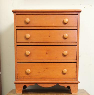 Appraisal: CHILD'S CHEST Pine with four graduated drawers shaped apron and