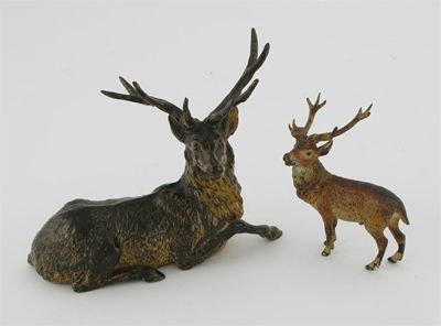 Appraisal: A cold painted bronze of a seated stag cm in