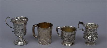 Appraisal: GROUP OF FOUR AMERICAN SILVER MUGS Comprising a stemmed repouss