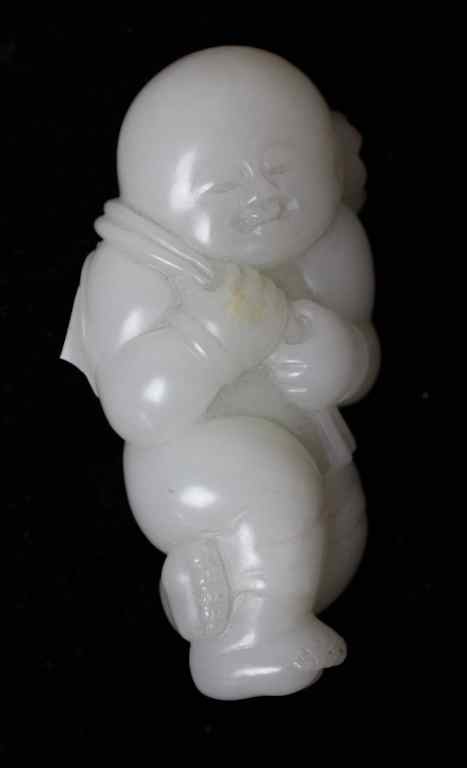 Appraisal: CHINESE WHITE JADE CARVING OF A CHILD Qing dynasty the