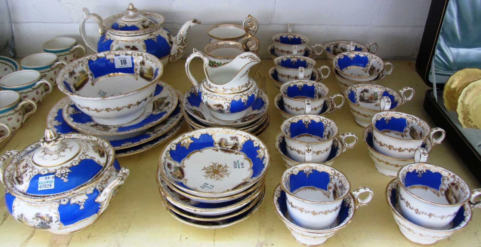 Appraisal: A Staffordshire porcelain tea service painted with landscapes against a