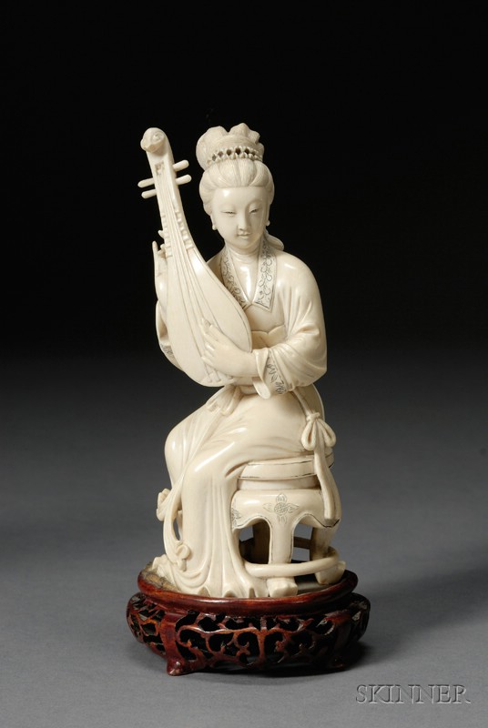 Appraisal: Ivory Carving China figure of a seated woman playing a