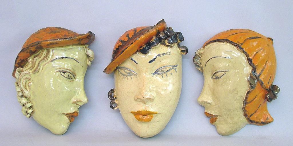 Appraisal: Three Vally Wieselthier terracotta glazed wall masks each high approx