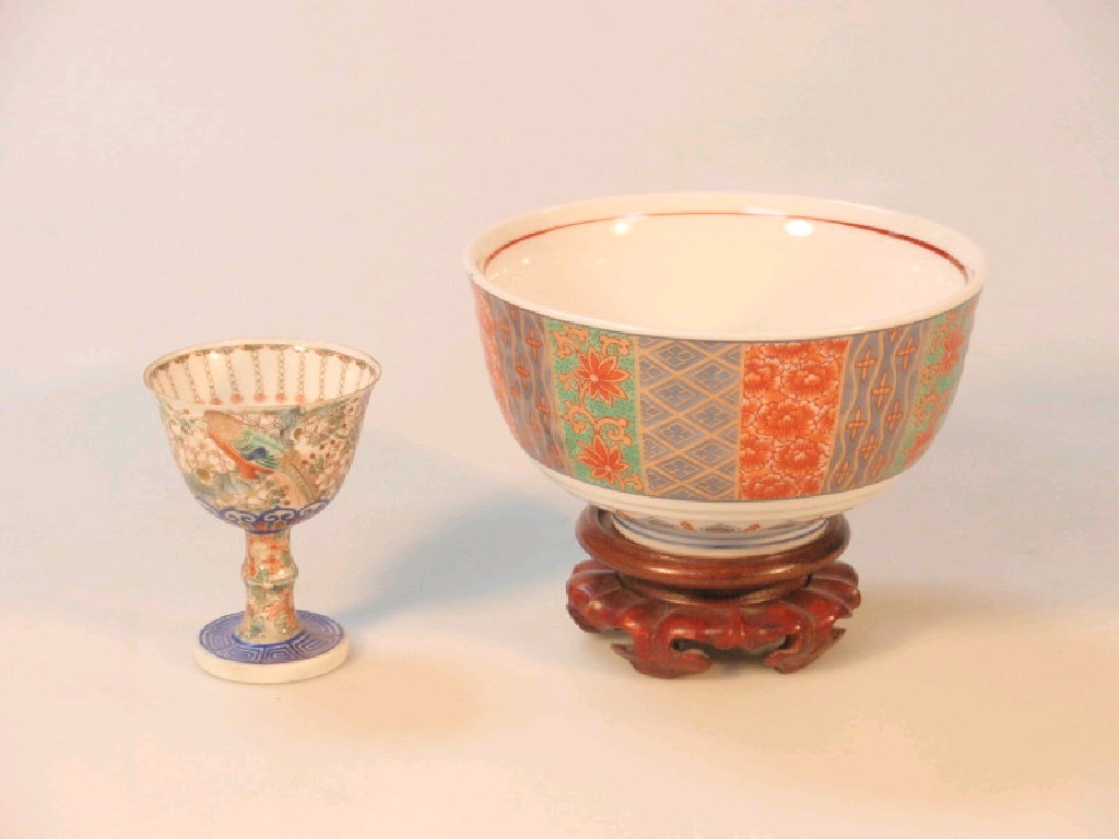 Appraisal: A Japanese bowl on hardwood pedestal and a stem cup