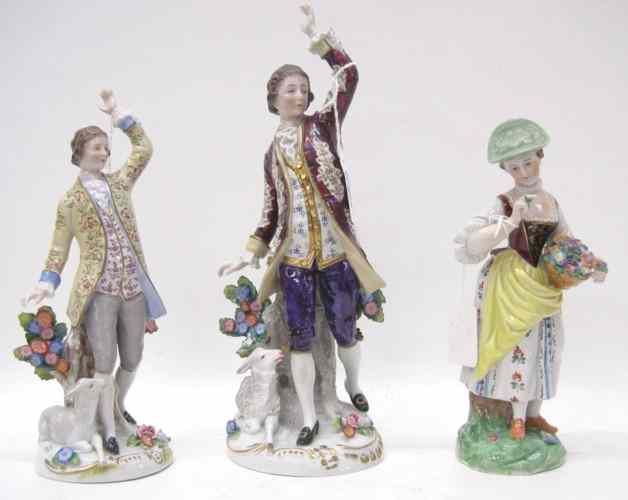 Appraisal: THREE GERMAN PORCELAIN FIGURINES hand painted the two gentlemen with