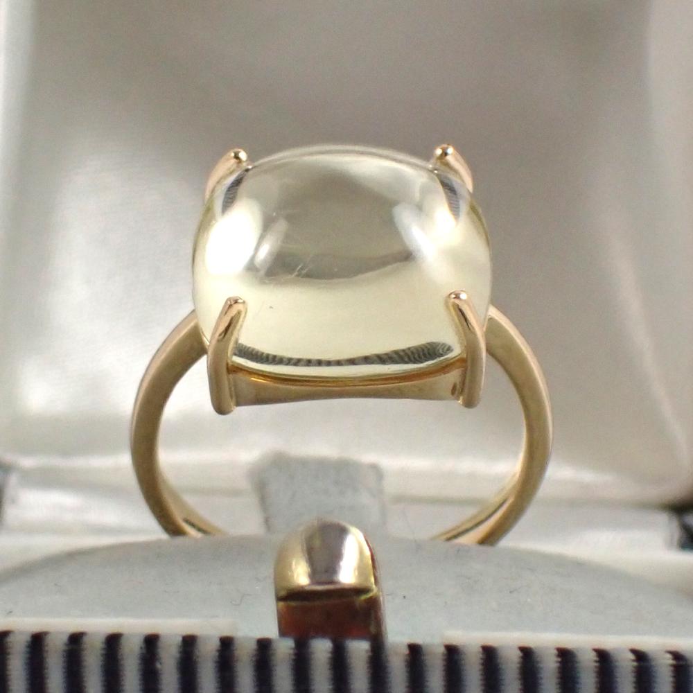 Appraisal: CITRINE AND FOURTEEN KARAT GOLD SOLITAIRE RING with four yellow