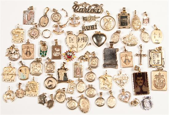 Appraisal: Assorted gold charms and pendants grams