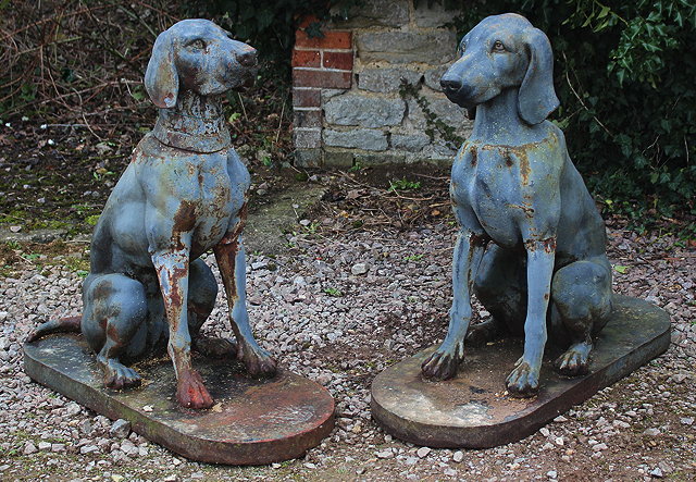 Appraisal: A PAIR OF GREY PAINTED CAST IRON SEATED HOUNDS one