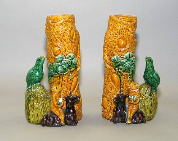 Appraisal: A pair of sancai glazed pottery tree form vases Each