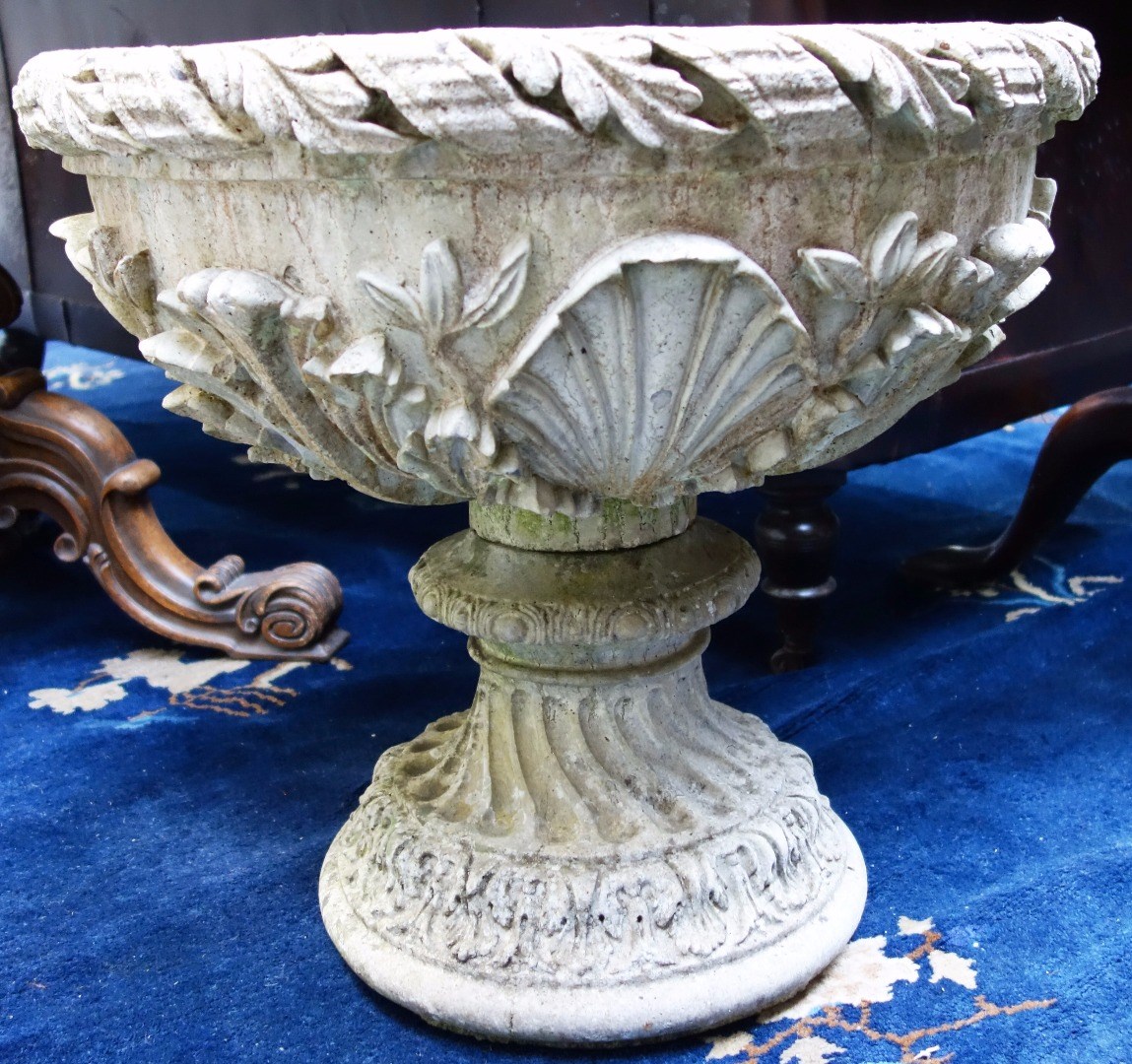 Appraisal: A pair of reconstituted stone circular planters with floral moulded