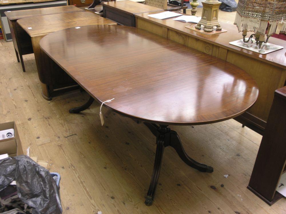 Appraisal: A reproduction cross-banded mahogany 'D' end dining table on twin