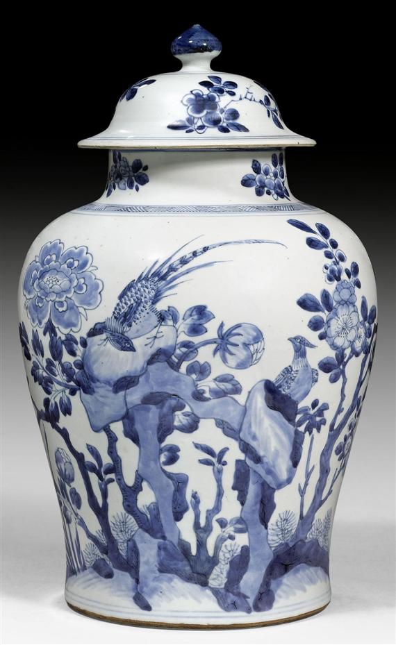 Appraisal: A BLUE AND WHITE COVERED VASE WITH PEONIES AND BIRDS