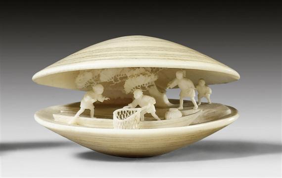 Appraisal: AN IVORY NETSUKE IN CLAM-SHAPE WITH A MINIATURE FIGURATIVE SCENE