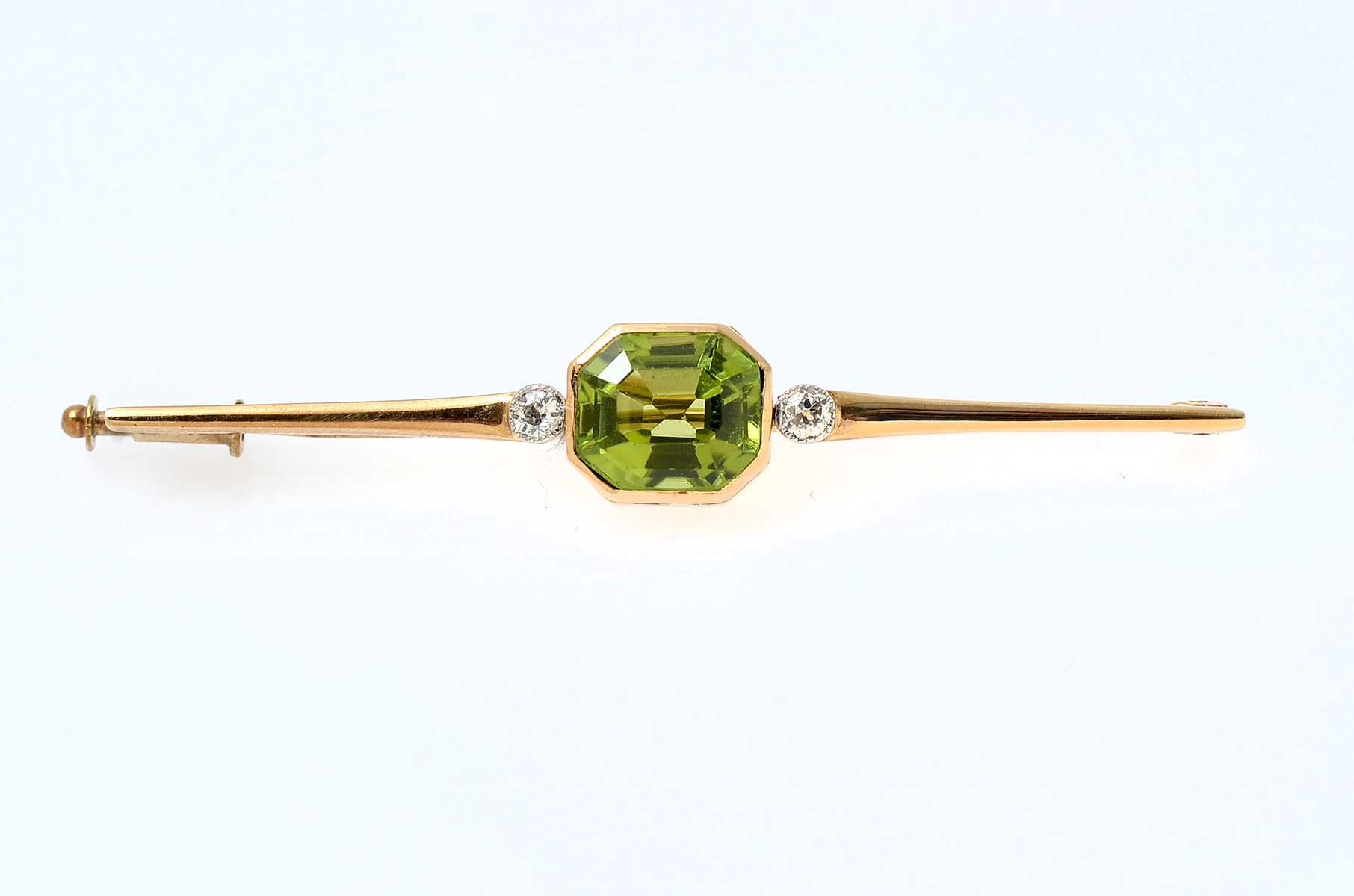 Appraisal: K DIAMOND PERIDOT PIN CT Peridot is centered and flanked