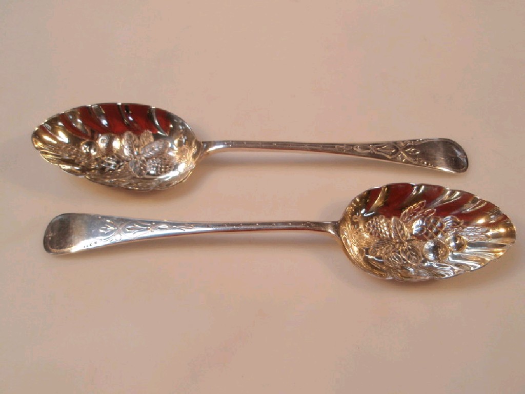 Appraisal: A pair of Victorian silver berry spoons bright cut decoration