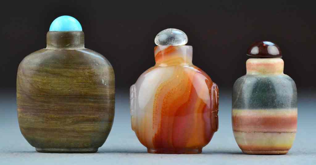 Appraisal: Chinese Agate Snuff BottlesTo include three agate examples largest is