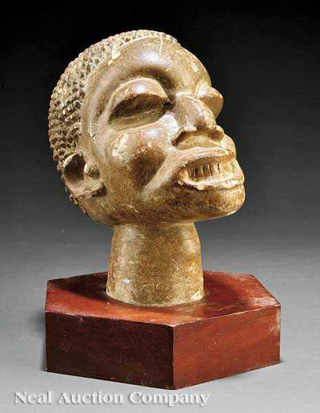 Appraisal: A Sierra Leone Carved Stone Head Mahen Yafe supported by