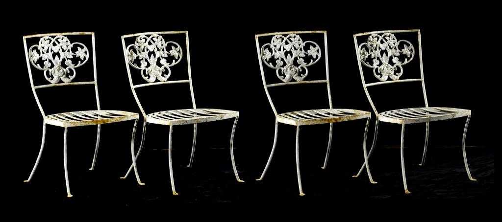 Appraisal: A SET OF FOUR WROUGHT IRON GARDEN CHAIRS the splat