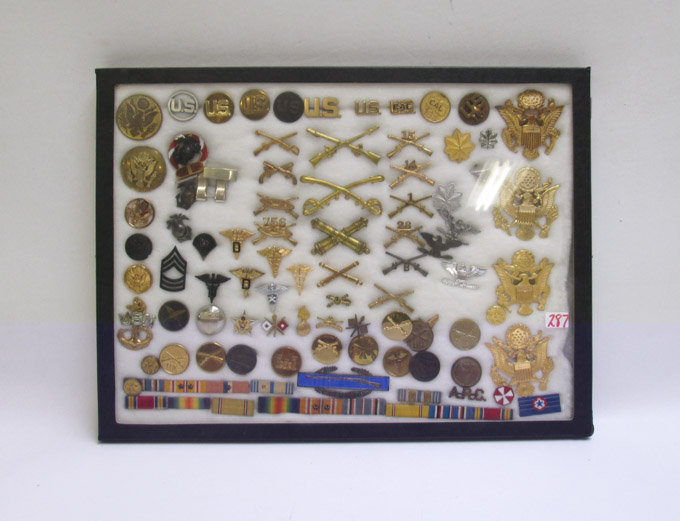 Appraisal: CASE OF U S MILITARY ARMY AND NAVY INSIGNIA four