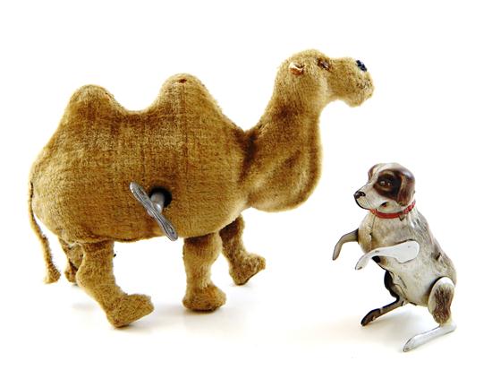 Appraisal: Two mid- th C wind-up toys two pieces camel with