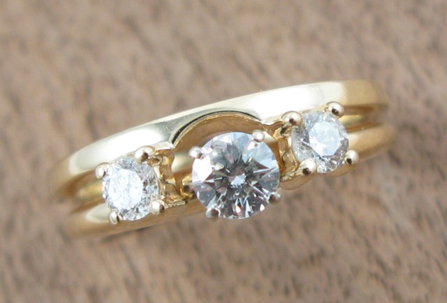 Appraisal: DIAMOND AND FOURTEEN KARAT GOLD RING set with three round