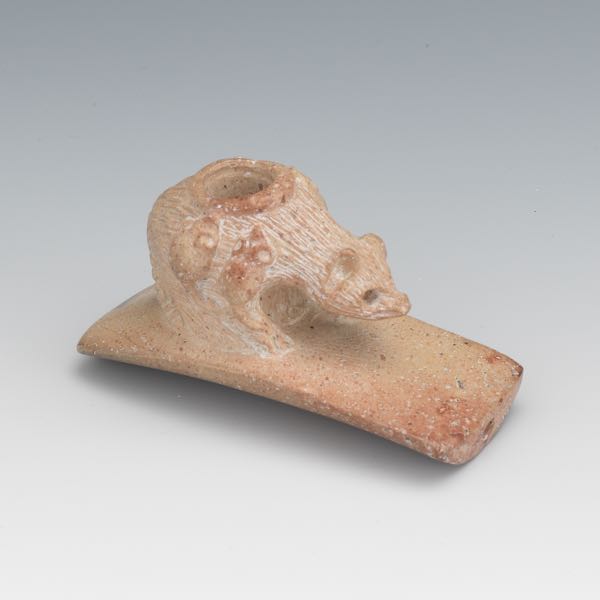 Appraisal: CARVED EFFIGY PIPE OF AN OPSSOM Carved effigy pipe of