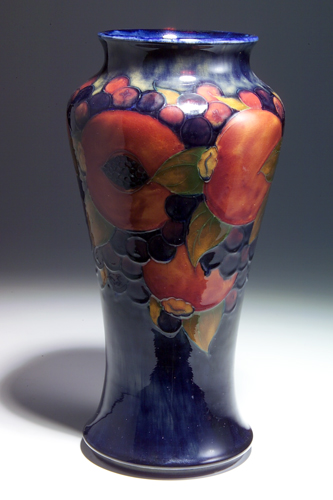 Appraisal: MOORCROFT Tall baluster vase decorated in the Pomegranate pattern against