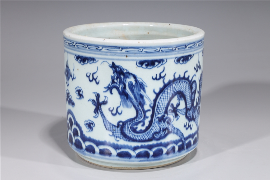 Appraisal: Chinese blue and white porcelain brush pot designs of dragons